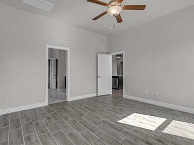 Unfurnished bedroom featuring ceiling fan and ligh