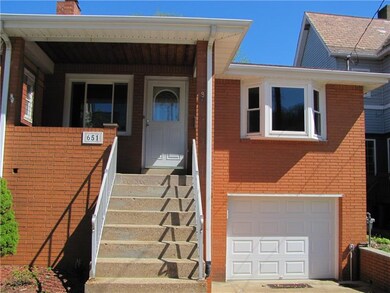 Covered front porch showing brand new garage door.