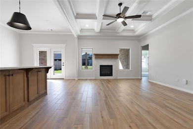 Unfurnished living room with beamed ceiling, light