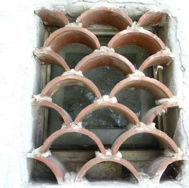 Decorative tile over bathroom window