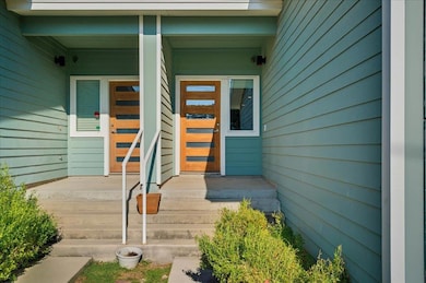 Entrance to property featuring a porch