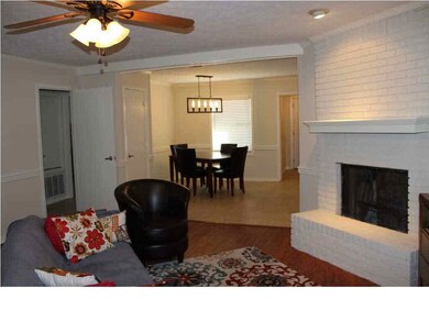 Living opens to dining and kitchen
