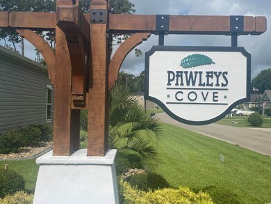 Community sign with a lawn