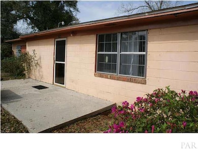 Cute cottage with a patio out front