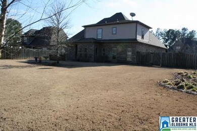 The back yard has a covered Patio with The HotSpri