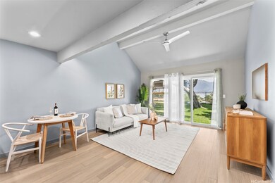 Living area opens to the green belt and the bay vi