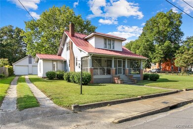 View of front of property with garage and a front