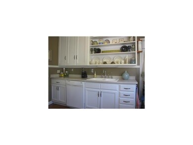 Kitchen. The kitchen is appointed with modern amen