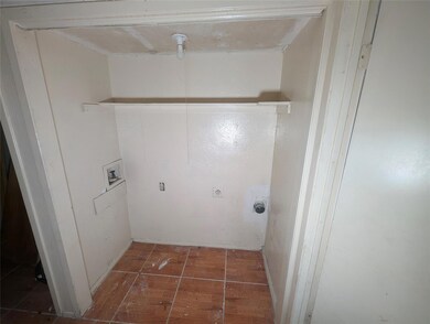 Washroom featuring hookup for a washing machine