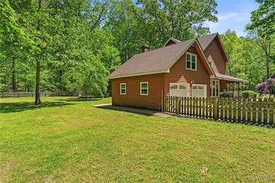 View of side of property with an attached garage,