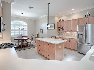 SPACIOUS KITCHEN WITH ISLAND, CORIAN COUNTER TOPS 