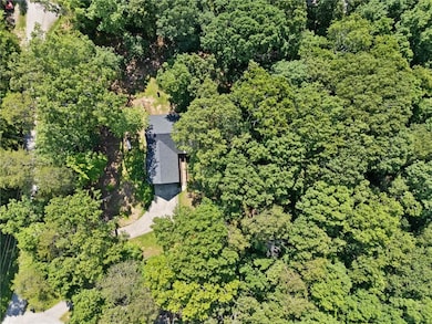 View of property location featuring a heavily wooded area