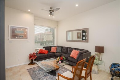 Tiled living room with ceiling fan