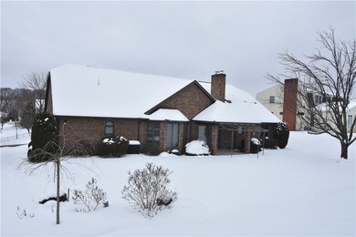 Rear view, sliding door from LR to rear awning covered concrete porch.  Yard is 100' wide by 155' deep.  Nicely landscaped!