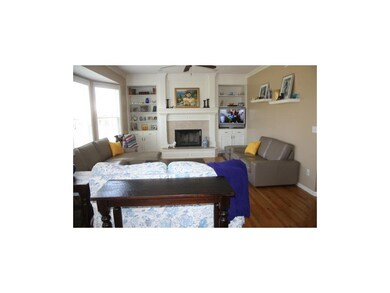 Great room with hardwood floors and fireplace