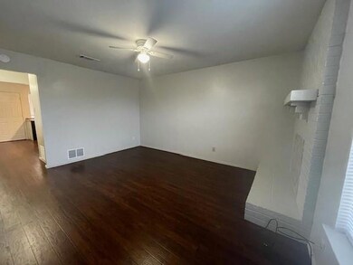Spare room featuring dark hardwood / wood-style fl