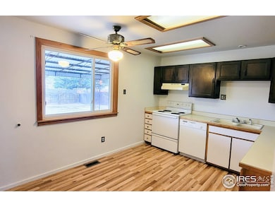 Roomy kitchen with view of expansive backyard