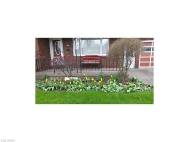 Enjoy the beautiful tulips from your front porch t