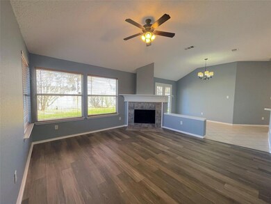 Unfurnished living room featuring ceiling fan with