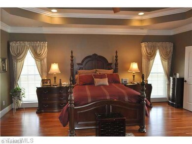 Master Bedroom. This grand master bedroom is exceptionally large and opens to both a Ritz Carlton styled bath and the home s living room.