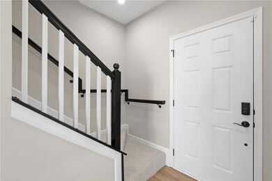 Entrance foyer featuring stairway, baseboards, and