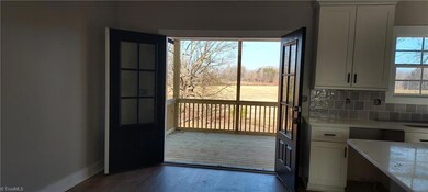 Double Doors in the Dining Area that open to the Covered Porch with this amazing view!