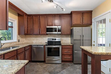 Renovated kitchen with granite and stainless appli
