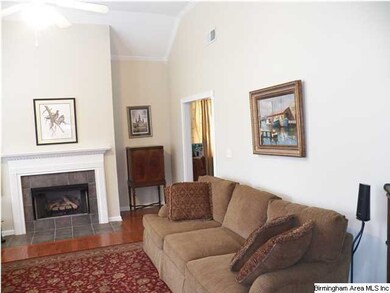 Cozy fireplace with gas logs & hardwood flooring i