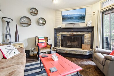 Living area with a fireplace and wood finished flo