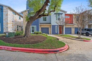 Townhome / multi-family property featuring drivew