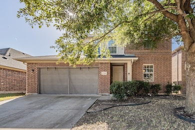 View of front of house featuring concrete driveway, a garage, brick siding, and a shingled roof
