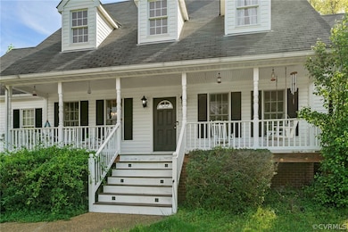 Cape cod-style house featuring a porch