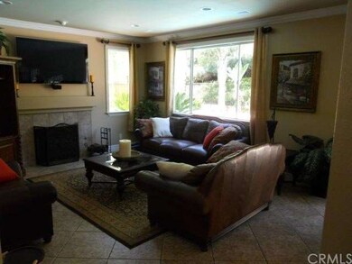 Family room with cozy fireplace and view of sparkl
