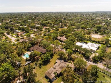 Aerial view of neighborhood and surrounding homes.