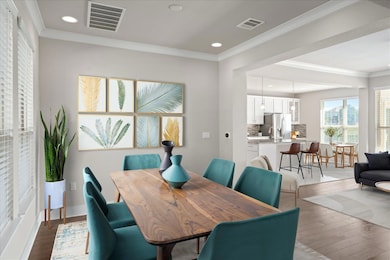 Dining area featuring wood finished floors, reces
