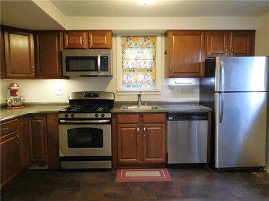 The kitchen features stainless steel appliances an