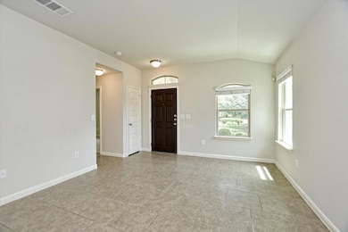 Foyer entrance with vaulted ceiling and light til