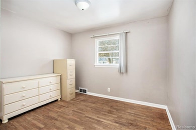 bedroom featuring true hardwood floors
