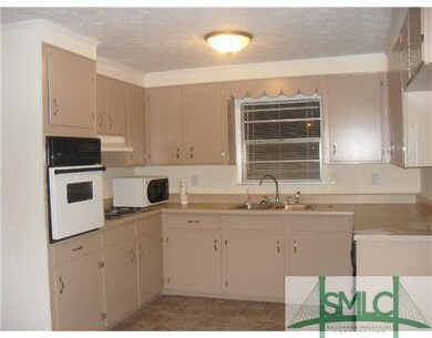 Kitchen. Tons of cabinet space in pretty kitchen w