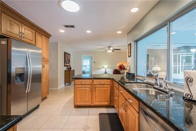 Kitchen and breakfast bar open to the separate fam