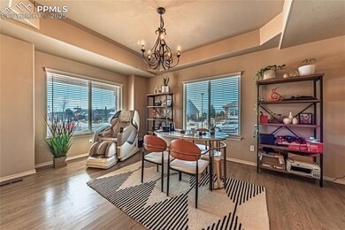 Dining space with visible vents, wood finished flo