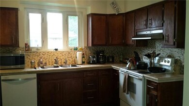 KITCHEN WITH UPDATED BACKSPLASH AND FLOORS