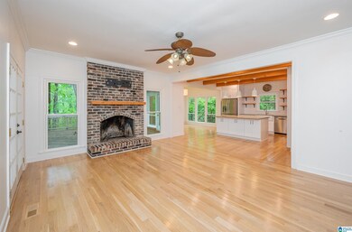 Warm, brick fireplace serves as the center piece o