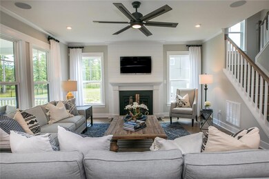 The first floor offers a large dining room with board and batten trim. The office has a closet and barn doors. Hardwoods throughout most of the downstairs. Spacious first floor guest suite. DESIGNER Kitchen with huge quartz island and walk-in pantry.