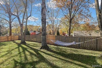 View of fenced backyard