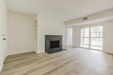 Unfurnished living room featuring light wood-styl