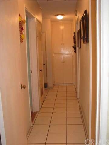 Hallway leads to bedrooms