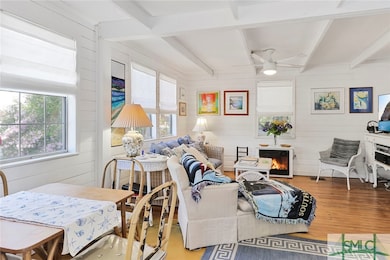 Bright windows, wood flooring, electric fireplace