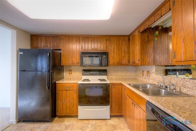 The kitchen features new counter tops, back splash