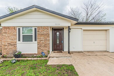 Doorway to property featuring an attached garage, 